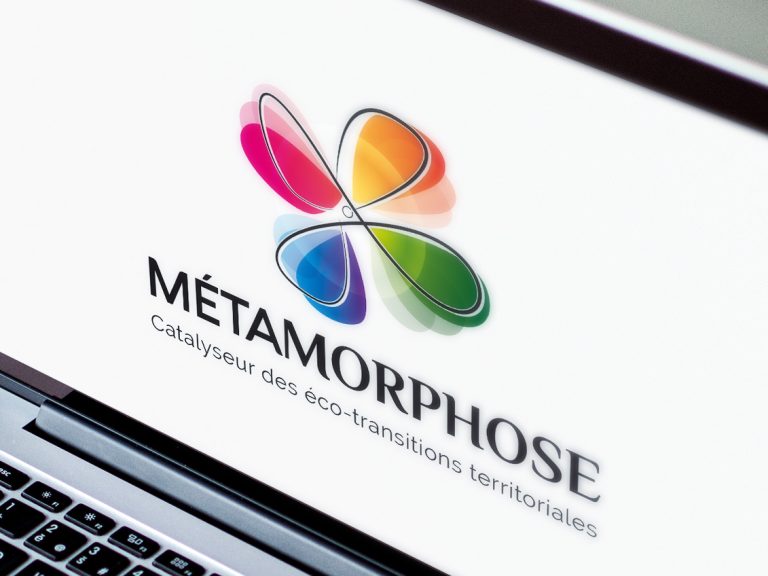 Metmorphose Une Logo Métamorphose, fleur multicolore, affiché sur un ordinateur portable