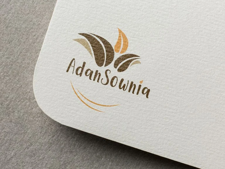 Carte de visite Adansownia, logo feuille orange, marron et beige sur papier texturé